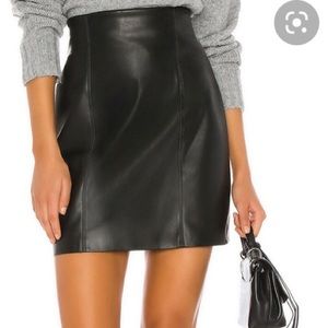 Size 10 faux leather skirt. Hits above the knees.